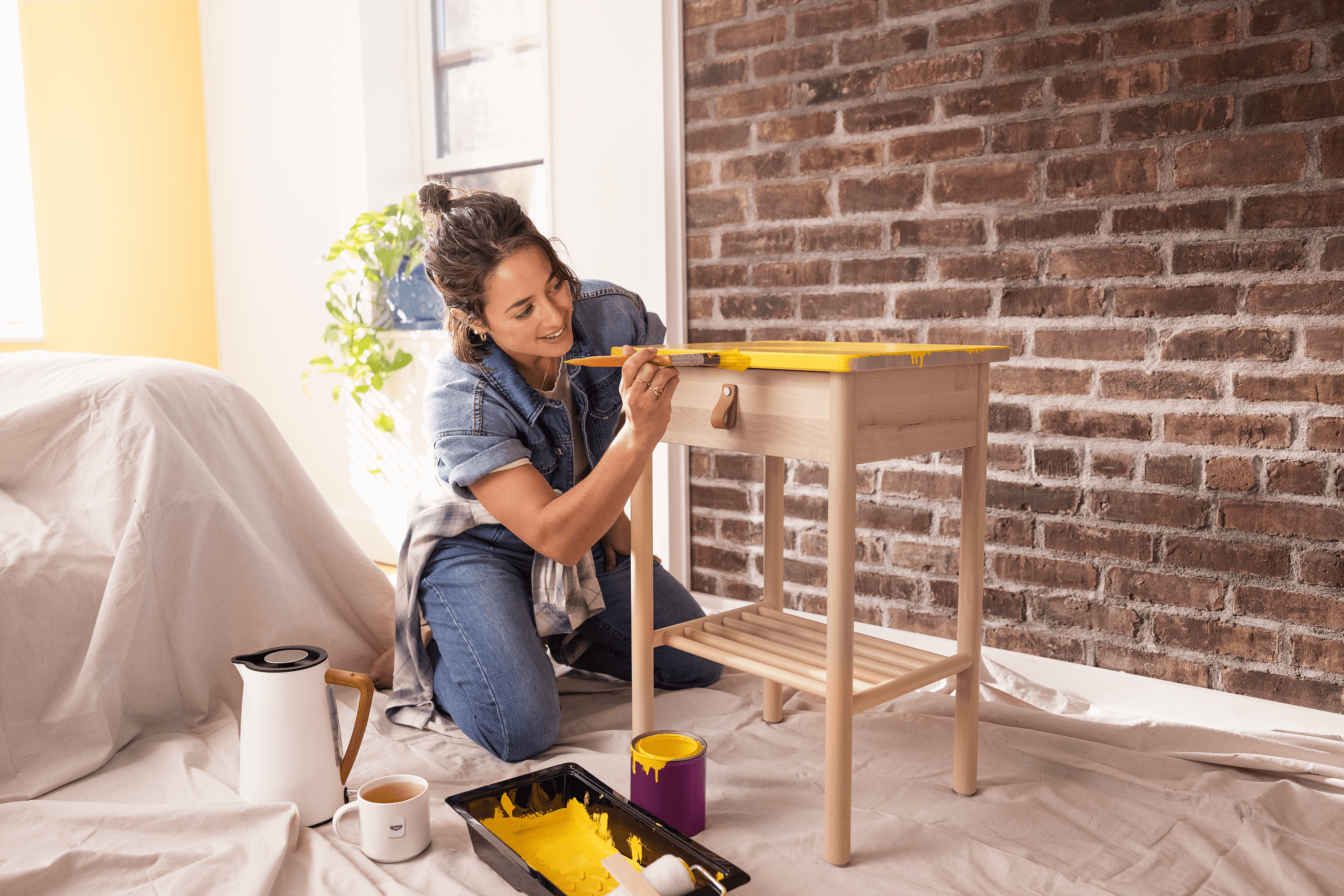 Woman painting furniture